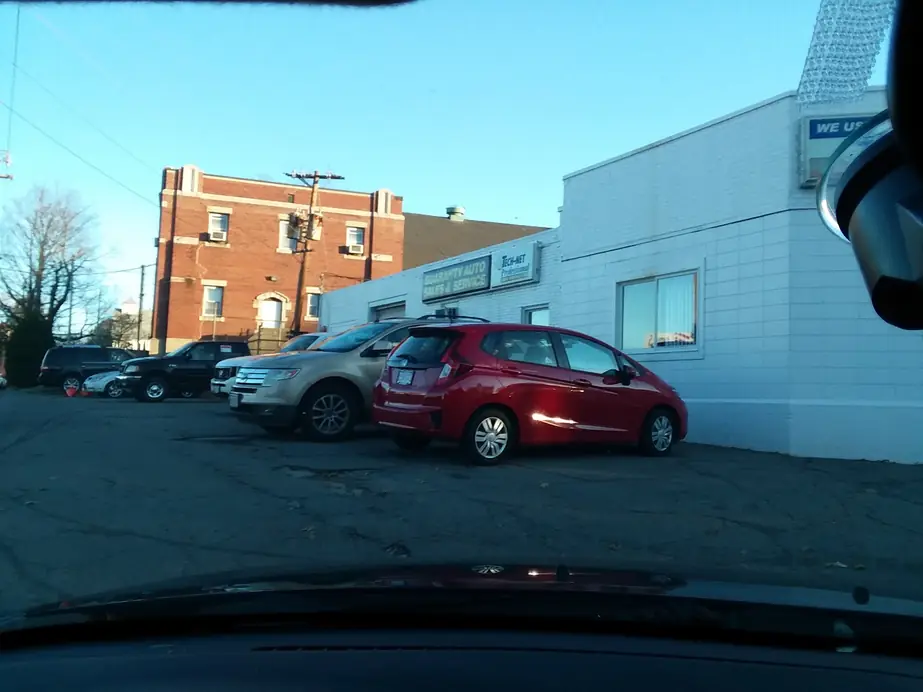The Guaranty Auto shop building and signage on Chestnut Street in Clinton, MA