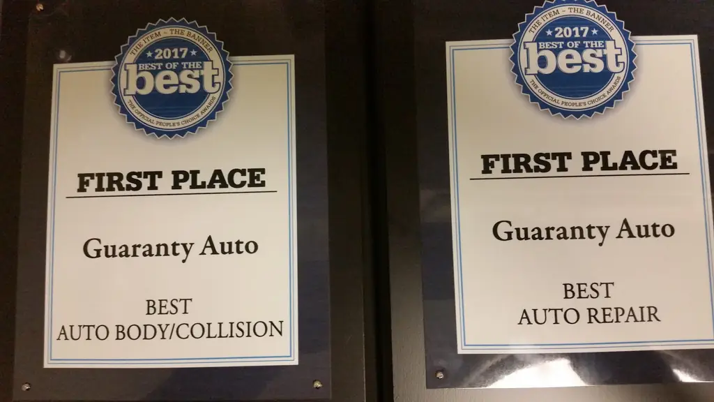 Two 2017 Best of the Best First Place plaques for Guaranty Auto: Best Auto Body/Collision and Best Auto Repair