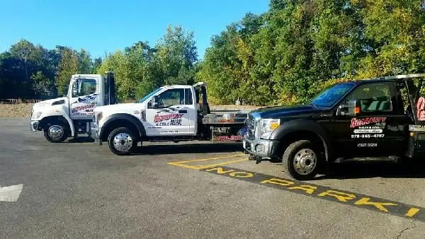 Three of the Guaranty Auto tow trucks lined up