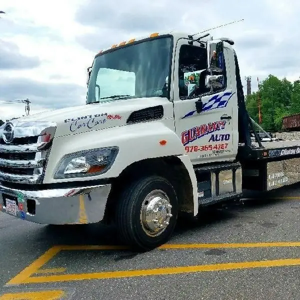 The Guaranty Auto Hino flatbed tow truck